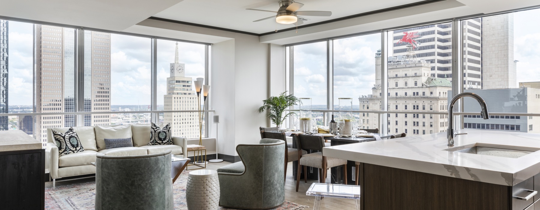 Spaces created just for you. chairs, tables, floor to ceiling windows and kitchen counter