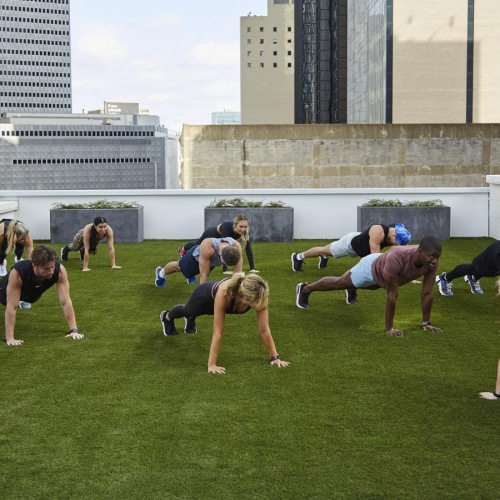 Get your workout on a group of people doing yoga
