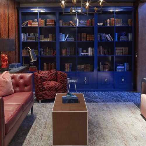 Enjoy our resident-only features library with a couch and bookshelves